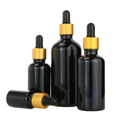 China Personal Care Essential Oil Bottle Black Round Round Essential Oil Dropper Black Cosmetic Glass Bottle for sale