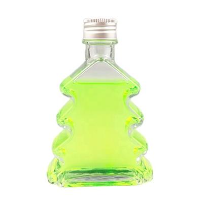 China Bulk Beverage Liquor Wine Storage Glass Bottles 200ml Juicy Drinks Christmas Tree Shaped Glass Bottle With Cork for sale