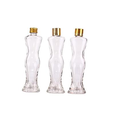 China Custom logowhiskey beverage bottle human body shape glass perfume bottle glass vodka bottle for sale