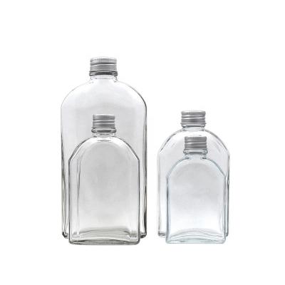 China 250ML 350ML Empty Clear Glass Beverage Beverage Bottle With Screw Cap for sale