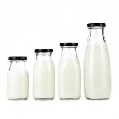 China 8oz 16oz 32oz Classic Round Glass Milk Bottle with Gold Metal Lid for sale