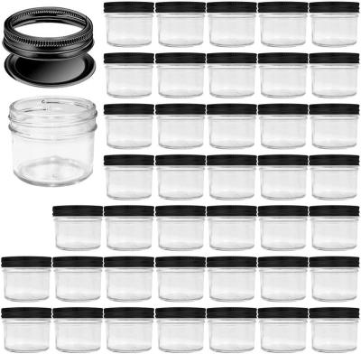 China Hot Selling Mason Jars Wide Mouth Mini Canning Jars 4oz Glass Freshness Preservation Small Jars With Black Lids for sale