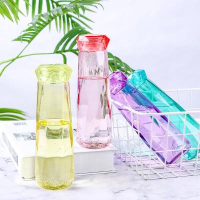 China Viable Creativity Portable Diamond Shaped Glass Water Bottle with Crystal Shape Lid for sale