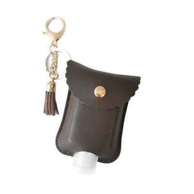 China Leather hand sanitizer holder with key chain to be cut. Customize Design Faux PU Leather Hand Sanitizer Chain Key Holder With Leather Tassels for sale