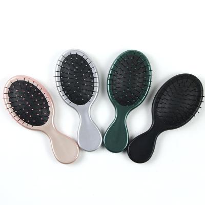 China Salon 4PCs Set 4 Packs Different Colors Small Oval Round Plastic Detangling Brush Detangler Comb Detangling Hair Brush for sale