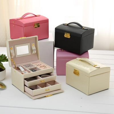 China Leather Showcase Jewelry Storage Organizer Box With Lock And Key Three Layer Two Drawers With Mirror for sale