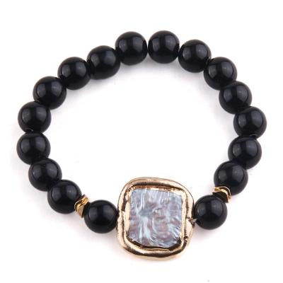 China Latest 3 Unisex Environmentally Friendly Black Elastic Freshwater Gemstone Lava Gold Shell Mother Stretch Bead Bracelet Energy Bead Bracelet for sale