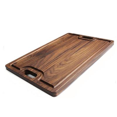 China Sustainable Friendly Large Walnut Wooden Laser Cutting Chopper With Cutout Handles for sale