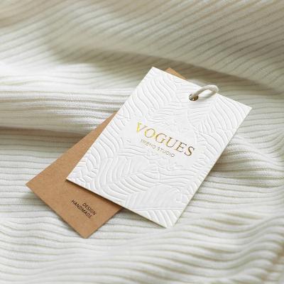 Cina Custom Embossed Name Logo Recycled Seed Foil Print Sustainable Free Sample Luxury Textured Paper Hang Tags For Apparel in vendita