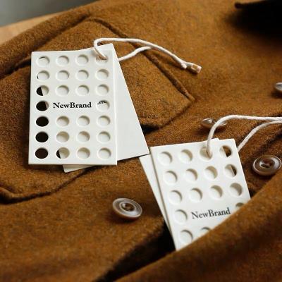 China Viable Wholesale Hollow Dot Custom Logo Clothing Tag String Hang Tag For Clothing Own Logo for sale