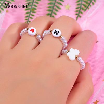 China TRENDY Fashion Stretchy Simulated Pearl Adjustable Stackable Girls Party Shell Initial Women's Butterfly Pearl Ring 3Pcs/Lot Name Rings for sale