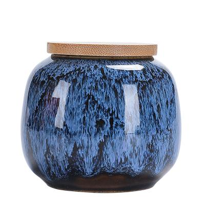 China Microwavable Portable Creative Small Household Glaze Ceramic Tea Storage Jar With Wooden Lid for sale