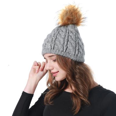 China 2021 Image Newcomers Fashion Women Artist Soft Warm Casual Hat Solid Fur Pompom Knitted Beanie Hat for sale