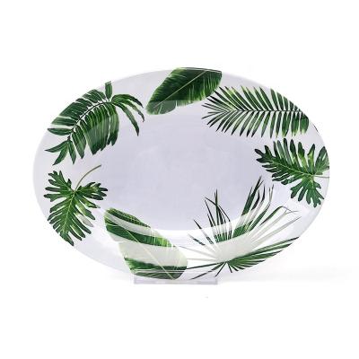 China Charming Pattern Melamine Leaf Green Hylaea Design Stocked Oval Dinner Dish For Custom for sale