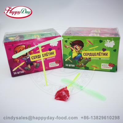 China Happyday Full Size Fruit Flavor Heart Lollipop With Mini Flying Toy Candy for sale