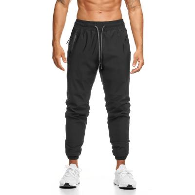 China Breathable Custom Jogger Men's Casual Sporty Bottom Narrow Pants Slim Fit Custom Workout Running Sweatpants Zipper Pockets Pant Men for sale