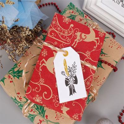 China Custom Recycled Materials Christmas Brown Kraft Paper Double Sided Printing New Gift Wrapping Paper Roll With Red And Green Pattern for sale