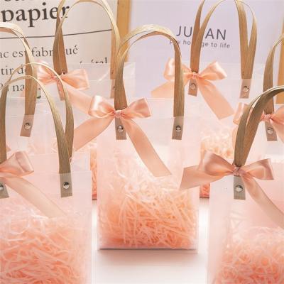 China Recyclable Custom Shopping Transparent PVC Bags Wedding Flower Candy Apparel Gift Packaging Plastic Purse With Ribbon for sale