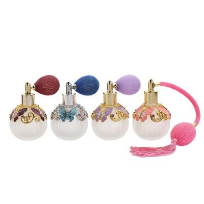 China Eco-friendly Recyclable Wholesale Vintage Embellished Airbag Under-bottling Spray Dubai Butterfly Embellished Essential Oil Perfume Bottle for sale