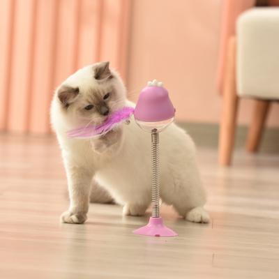 China Sustainable Pet Catnip Feather Led Swing Funny Cat Food Dispenser Toy for sale