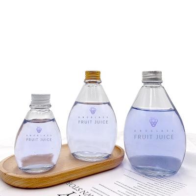 China Bulk Clear Beverage ONO Water Drop Shape Juice Glass Bottle 350ml 500ml For Fresh Juice Beverage Milk for sale