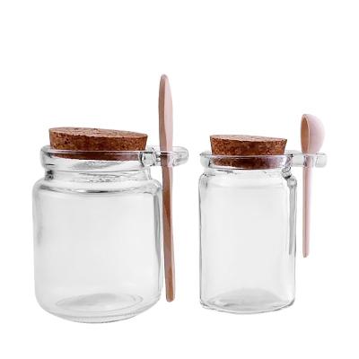 China New Food Pudding Glass Jar With Spoon Food Jar Honey Bottle 250ml Bath Salt Wooden Bottle for sale