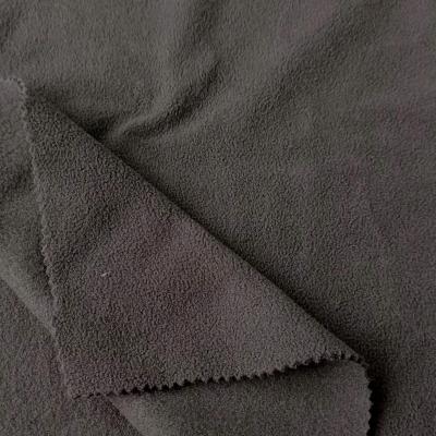 China High Quality 100% Polyester Fabric Anti Pill Shell Print Polar Fleece Fabric Soft For Garment New Design for sale