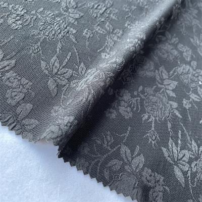 China Other Flower 2021 Designer Jacquard Polyester Spandex Fabric Black Garment for sale