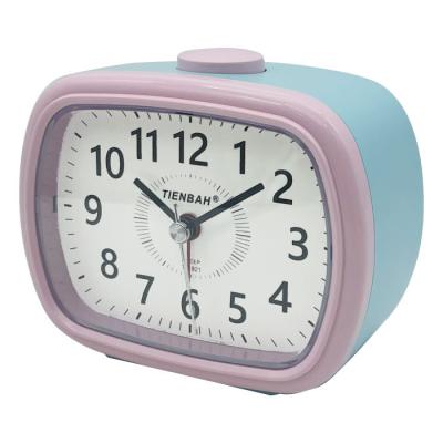 China LUMINOVA Oval Colorful Designed Wake Up Light Near Silent Buzzer Table Quartz Child Desk Alarm Clock for sale