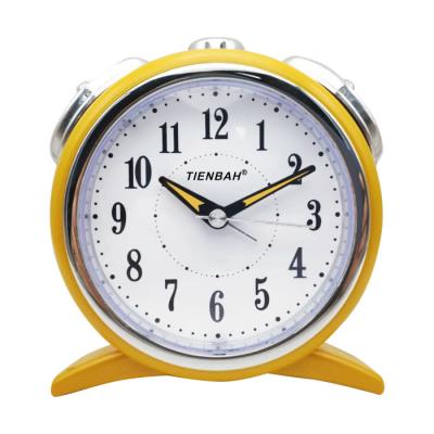 China Antique Style Colorful Battery Night Light Wake Up Silent Field Motion Desk Round Table Analog Alarm Clock for sale