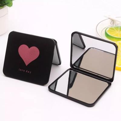 China Plastic Folding Pocket Mirror Makeup 2 Sided Small Portable Travel Pocket Mirror for sale