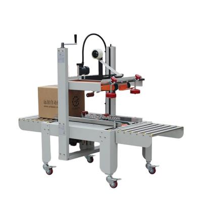 China Good price semi automatic CLOTHING carton case box taping sealing machine for wine box for sale