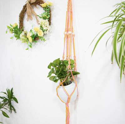 China 100% New 2022 Handmade Macrame Indoor Pant Hangers With Wood Beads Plant Hangers Cotton Woven Flower Planter Outdoor Pot Holder for sale