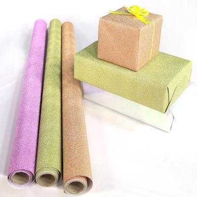 China ANTISTATIC Custom Design Gift Paper Rolls Glitter Powder Glue Christmas Wrapping Paper Bouquet for sale