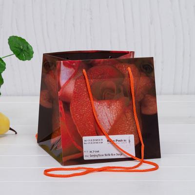 China Factory Wholesale Recyclable Gift Plastic Bag With Handles Florist Packaging Party Wedding Flower Bucket Bag for sale