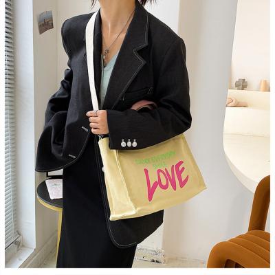 China Tote Bag Fashion Hit Canvas Handbag Eco Shopping Bag Color Printed Outdoor Beach Bag for sale