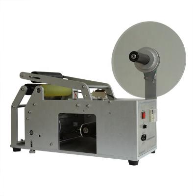 China OPLM-R CLOTHING Round Bottle Semi-automatic Labeling Machine for sale