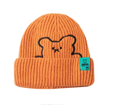 China 2021 COMMON Cute Bear Embroidery Female Autumn And Winter Warm Ear Protection Patch Wool Label Knitted Hat for sale