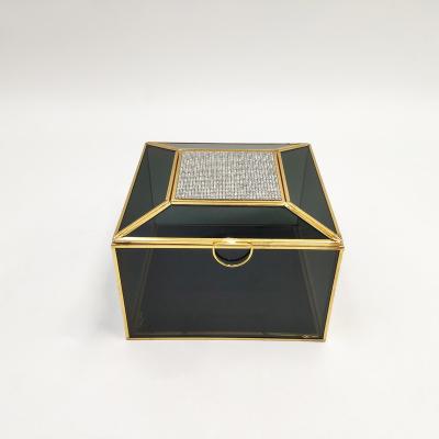 China Newest Crystal Diamond Veneer Black Gold Metal Handmade Glass Jewelry Box for sale