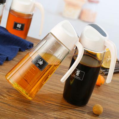 China 300/600/630ML Kitchen Oil Bottle Auto Open Viable Dispenser Glass Closing Bottles For Salad Dressing Honey Olive Oil Container for sale