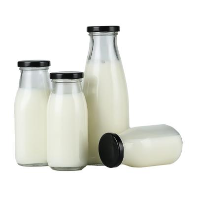 China Wholesale 200ml 250ml 500ml 1000ml Beverage Glass Milk Bottle With Metal Lid for sale