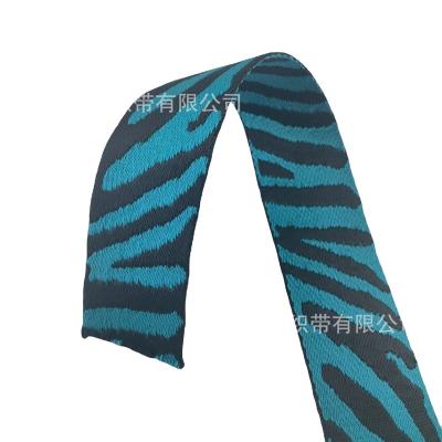 China New environmental friendly leopard printing spot polyester twill 5cm strap lake computer jacquard 1.7mm thick black blue webbing for sale