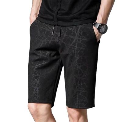 China Breathable Plus Size Mens Shorts Korean Loose Pattern Dark Black Camouflage Five Point Pants Men Beach Pants for sale