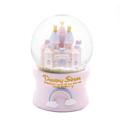 China Cute Europe Hand Carved Polyresin Castle Snow Globe, Resin Rainbow Castle Snowball For Kids Gift for sale