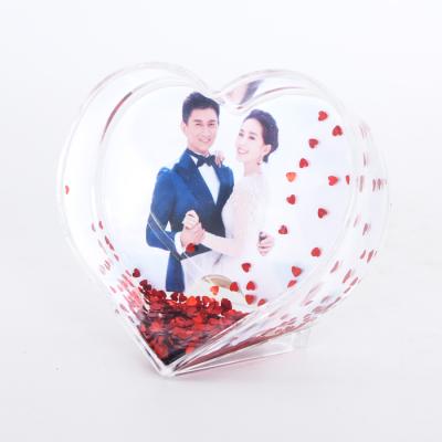 China Hot Sale Europe Heart Shape Plastic Acrylic Photo Snow Globe With Photo Insert for sale