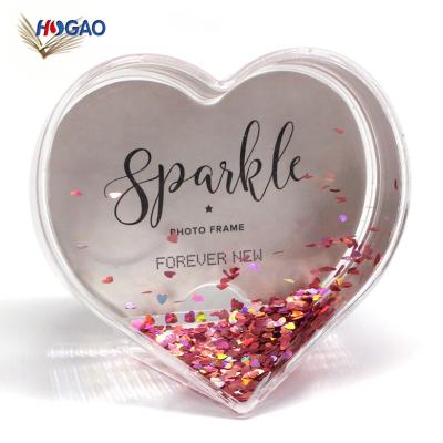 China Europe Wholesale Flying Like Heart Shaped Elegant Plastic Photo Frame DIY Wedding Favors Snow Globe For Your Own Photo for sale