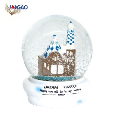 China Europe Customized Design Mystical Sea World Castle Glass Snow Globe With Stranding Snowflakes for sale