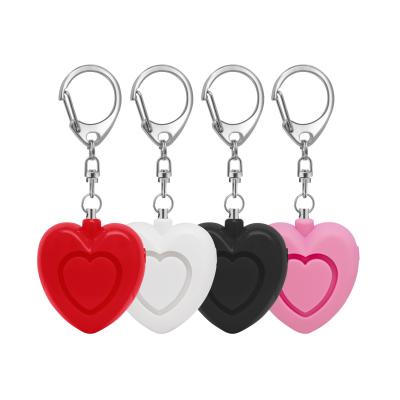 China 2022 new love heart amor alarm mini plastic flashlight self-defense key chain key chain for women self-defense llavero defensa personal for sale