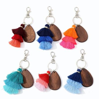 China Custom engravable wood key chain white wooden acorn three-layer woodchip disc key chain logo personalized woodkeychain for sale