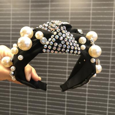 China New Fashion Friendly Material Fashion Knotted Pearl Headband In Wide Edge Pearl Headband for sale